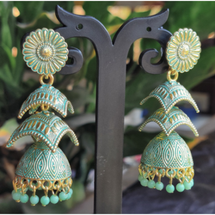 Enamelled golden earrings with beads
